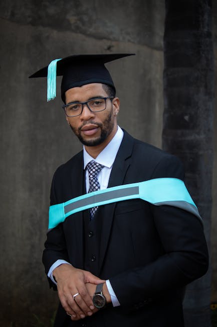Successful graduate proudly poses in cap and gown, symbolizing academic achievement and bright future.