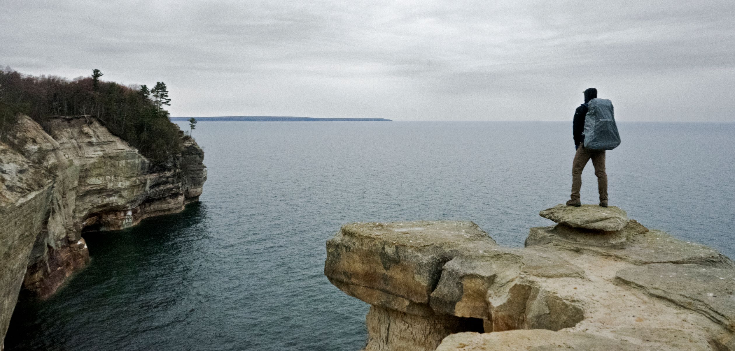 Man Standing on Rock on Cliff · Free Stock Photo
