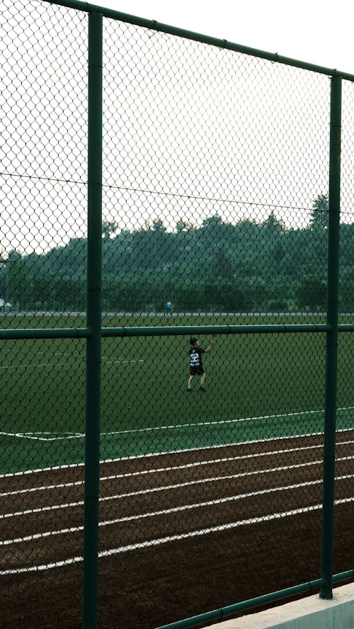 A person is playing soccer on a field