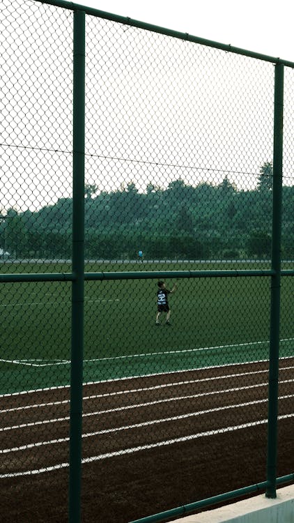 A person is playing soccer on a field