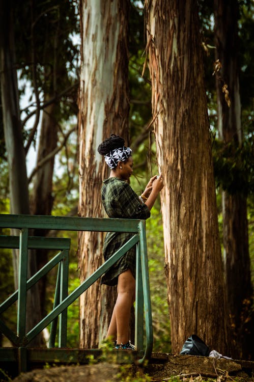 Woman Standing Beside Trees