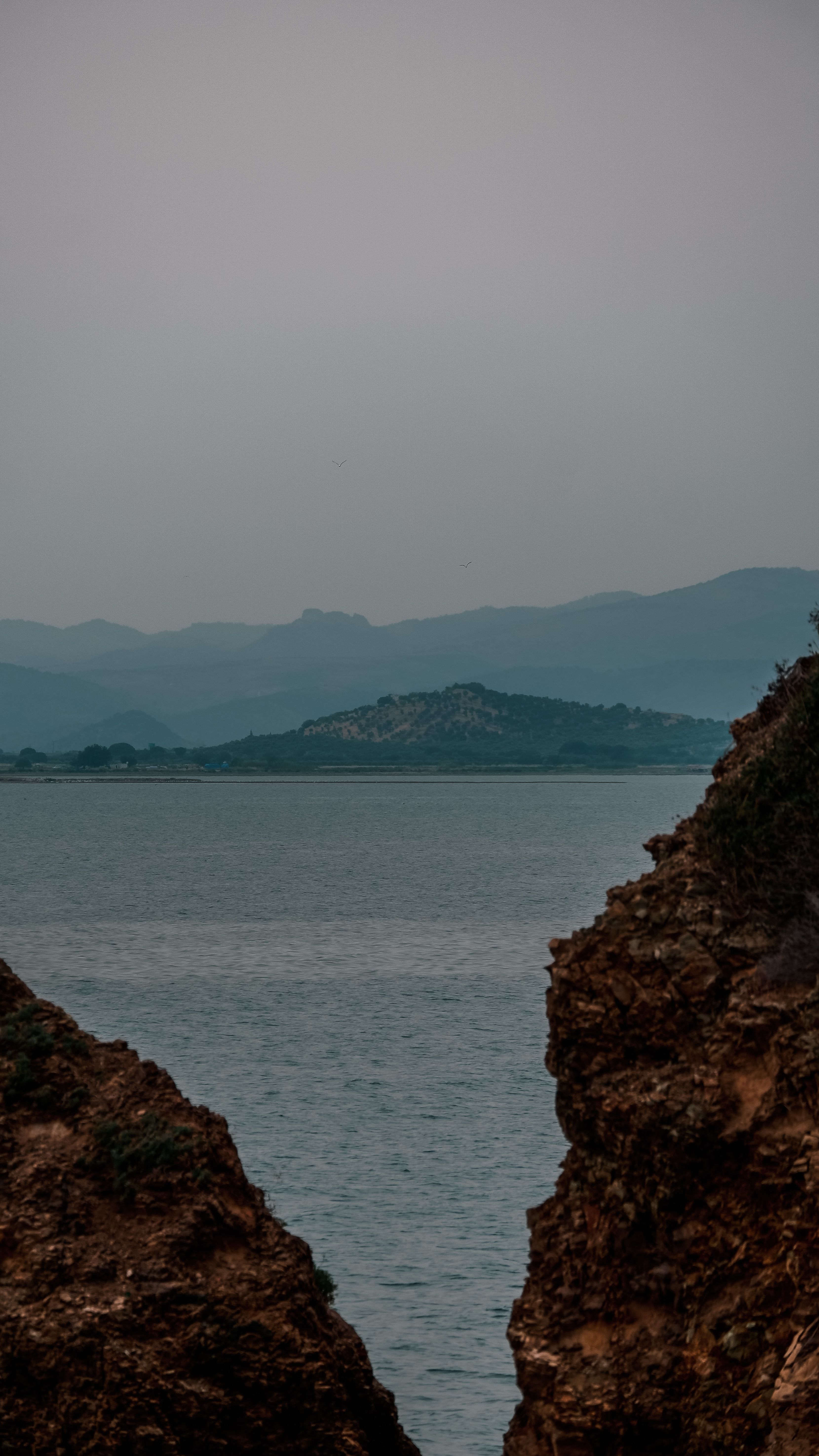 View of a Body of Water and Distant Mountains · Free Stock Photo