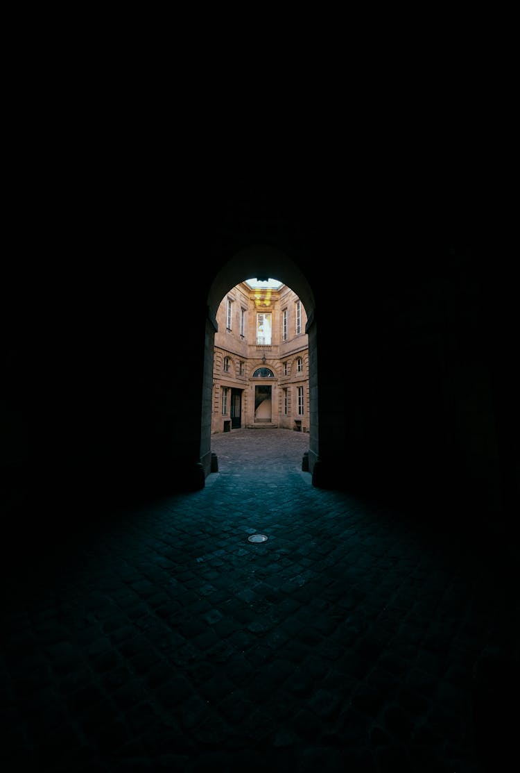 Archway To A Brown Concrete Building