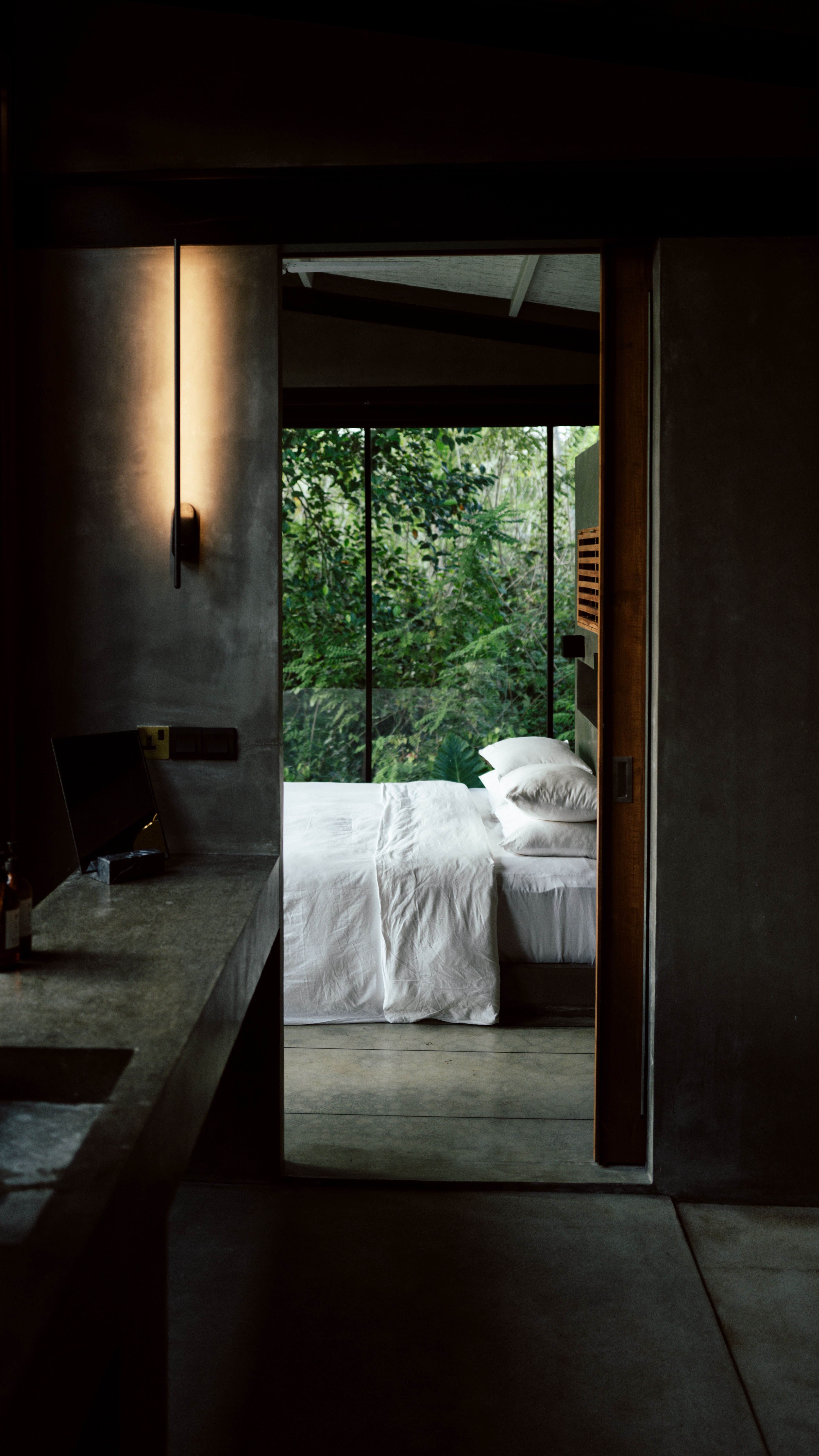 A suite with wooden interiors and a view of greenery