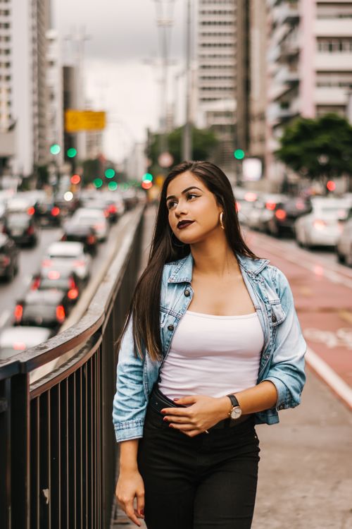 Free Fashionable woman in São Paulo with urban cityscape and traffic. Stock Photo