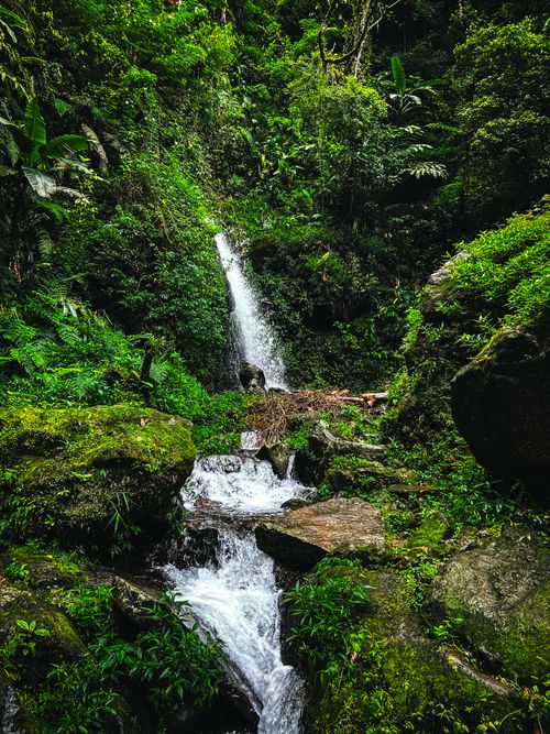Free Beautiful waterfall in the lush greenery of Kuningan, Jawa Barat, Indonesia, perfect for nature lovers. Stock Photo