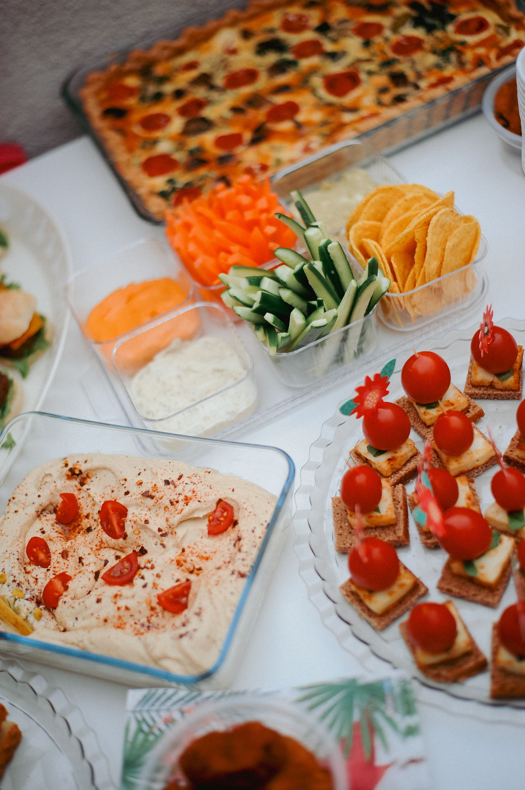 An inviting spread of appetizers featuring fresh vegetables, dips, and assorted snacks, perfect for gatherings.