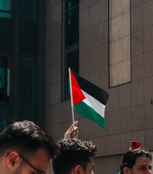 Palestine flag in the background