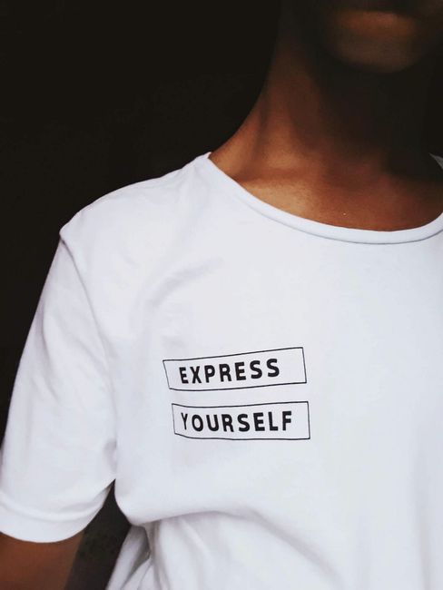 Minimalistic white t-shirt with 'Express Yourself' text, encouraging self-expression and individuality.