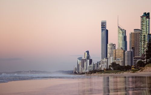 Free A breathtaking view of the Gold Coast skyline with modern skyscrapers along the beach at twilight. Stock Photo