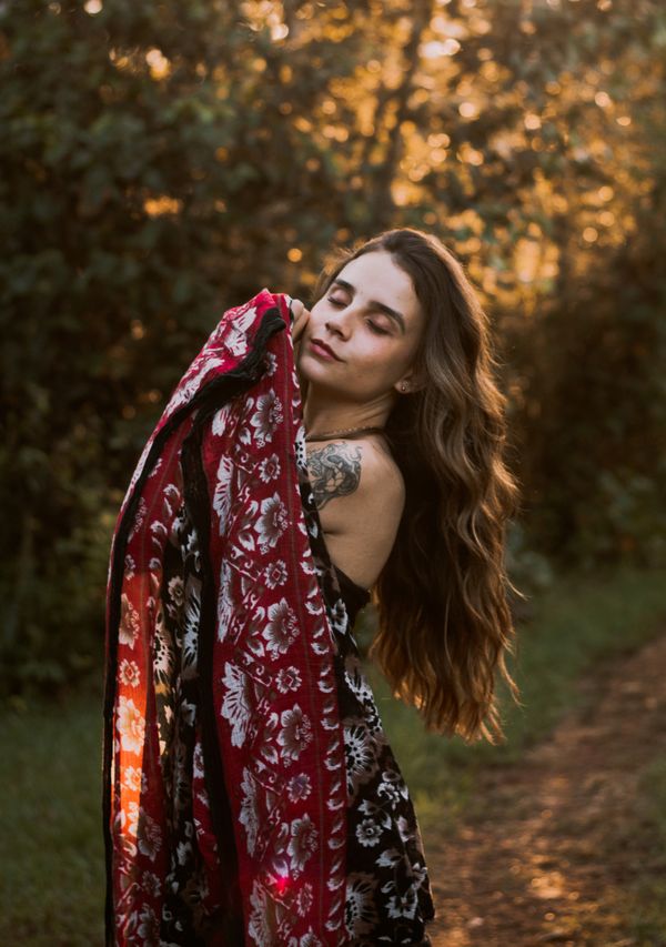 Girl in a Colorful Dress Posing in a Forest · Free Stock Photo