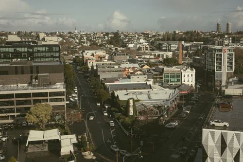 Free Aerial view of modern cityscape in Auckland, showcasing streets and architecture. Stock Photo