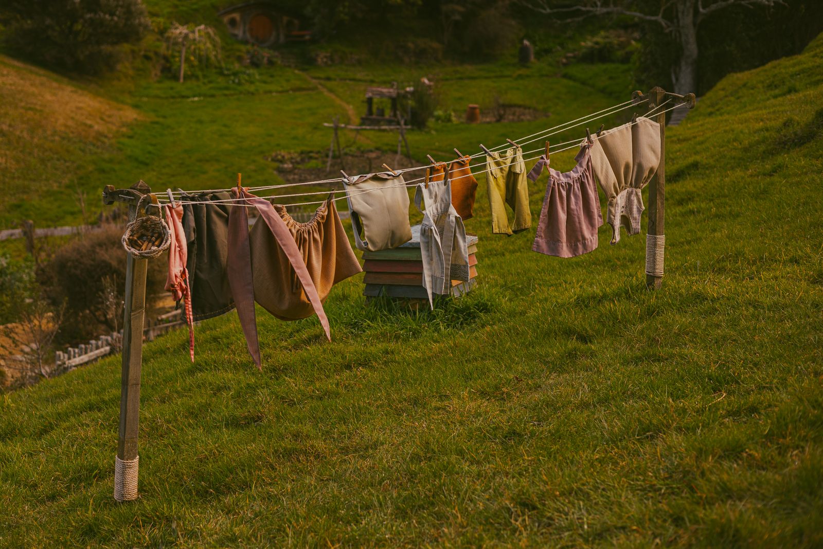 Colorful clothing hanging outdoors on a rustic clothesline with no people