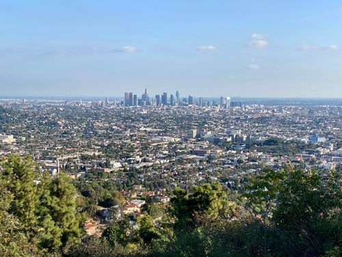 Free A breathtaking view of the Los Angeles skyline from Griffith Park, showcasing the vibrant city under a clear sky. Stock Photo