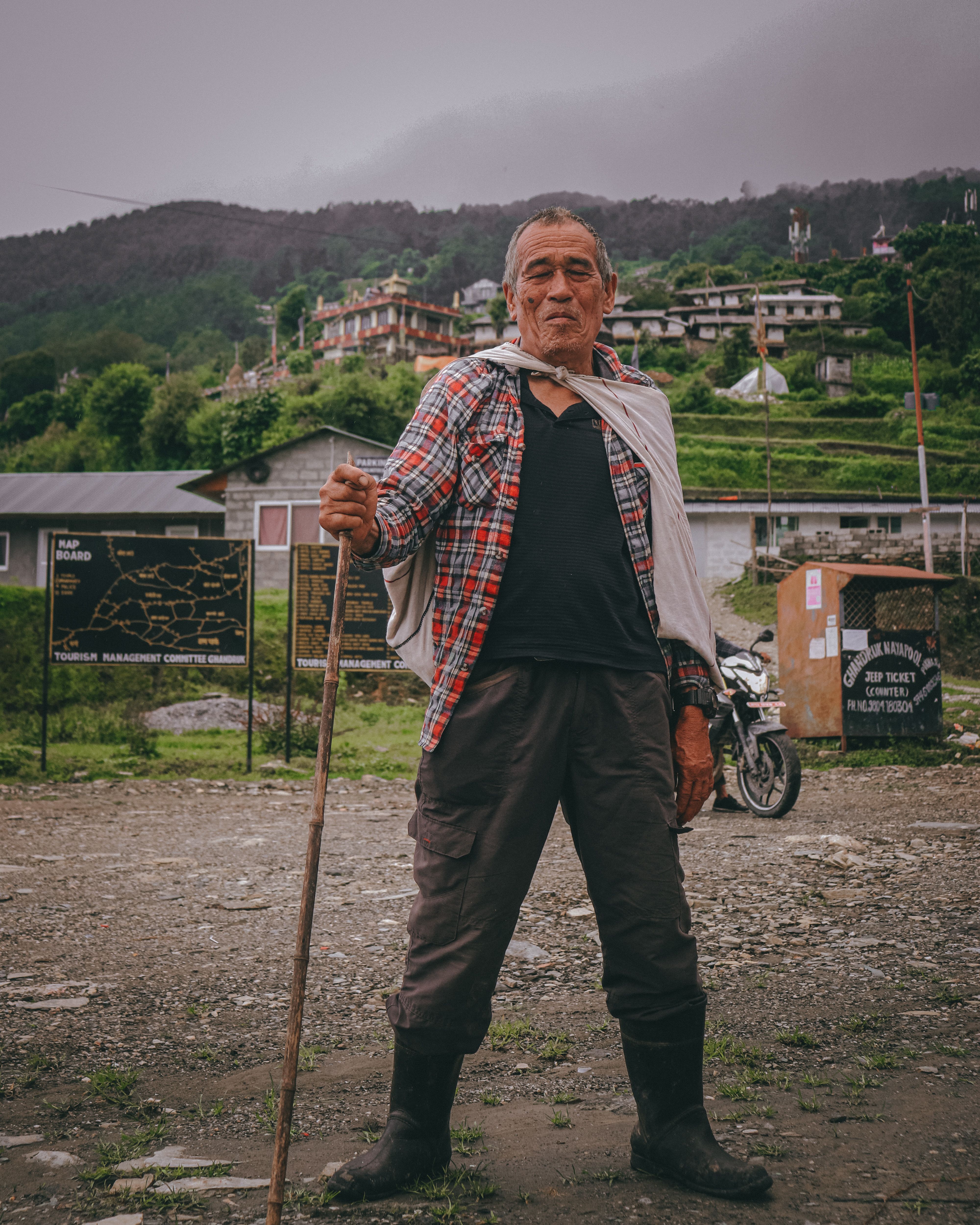 A Man Standing in a Village · Free Stock Photo