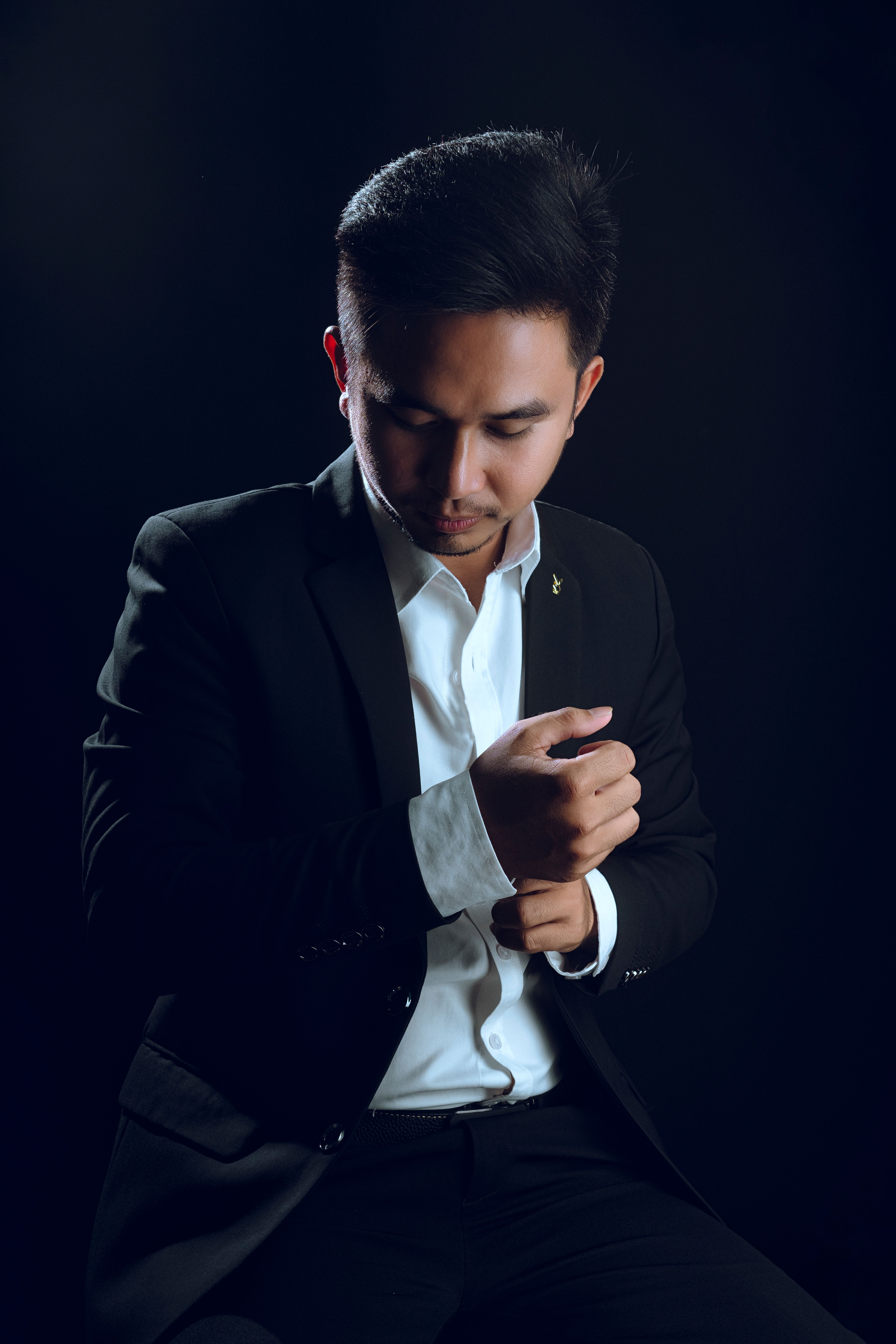 Young Man in a Black Suit and White Shirt · Free Stock Photo