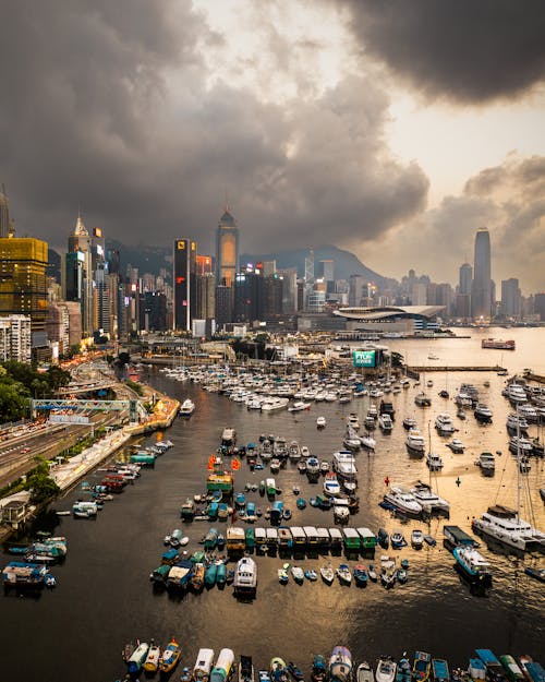 Hong kong cityscape with boats in the harbor