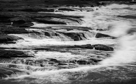 Captivating black and white image of coastal waterfalls at South Durras, Australia.