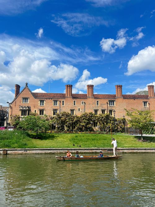 Free Peaceful boat ride on scenic river with historic Cambridge architecture. Stock Photo