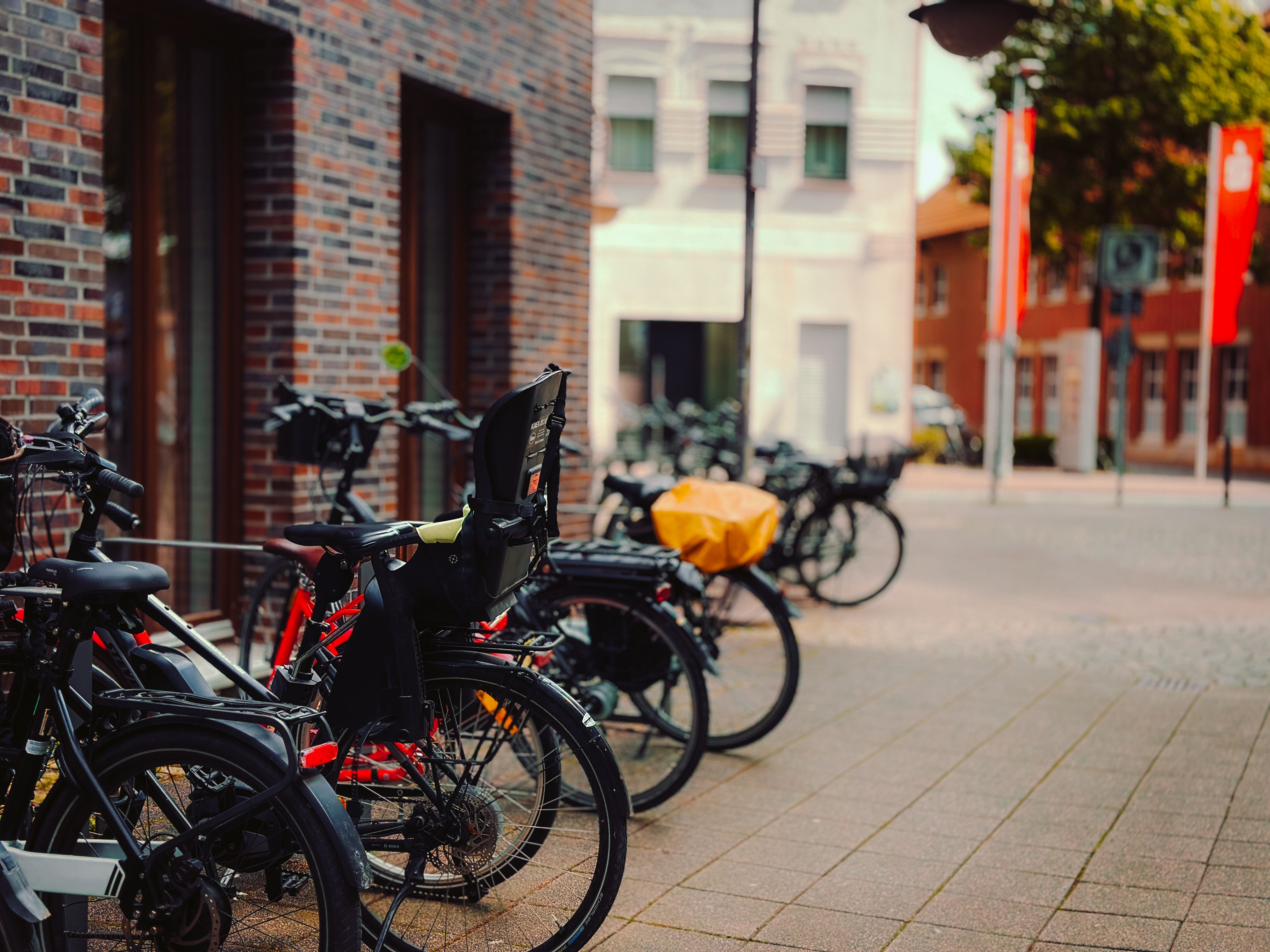 Multiple bicycles parked on a city street in NRW, Germany, emphasizing urban mobility and ecology.