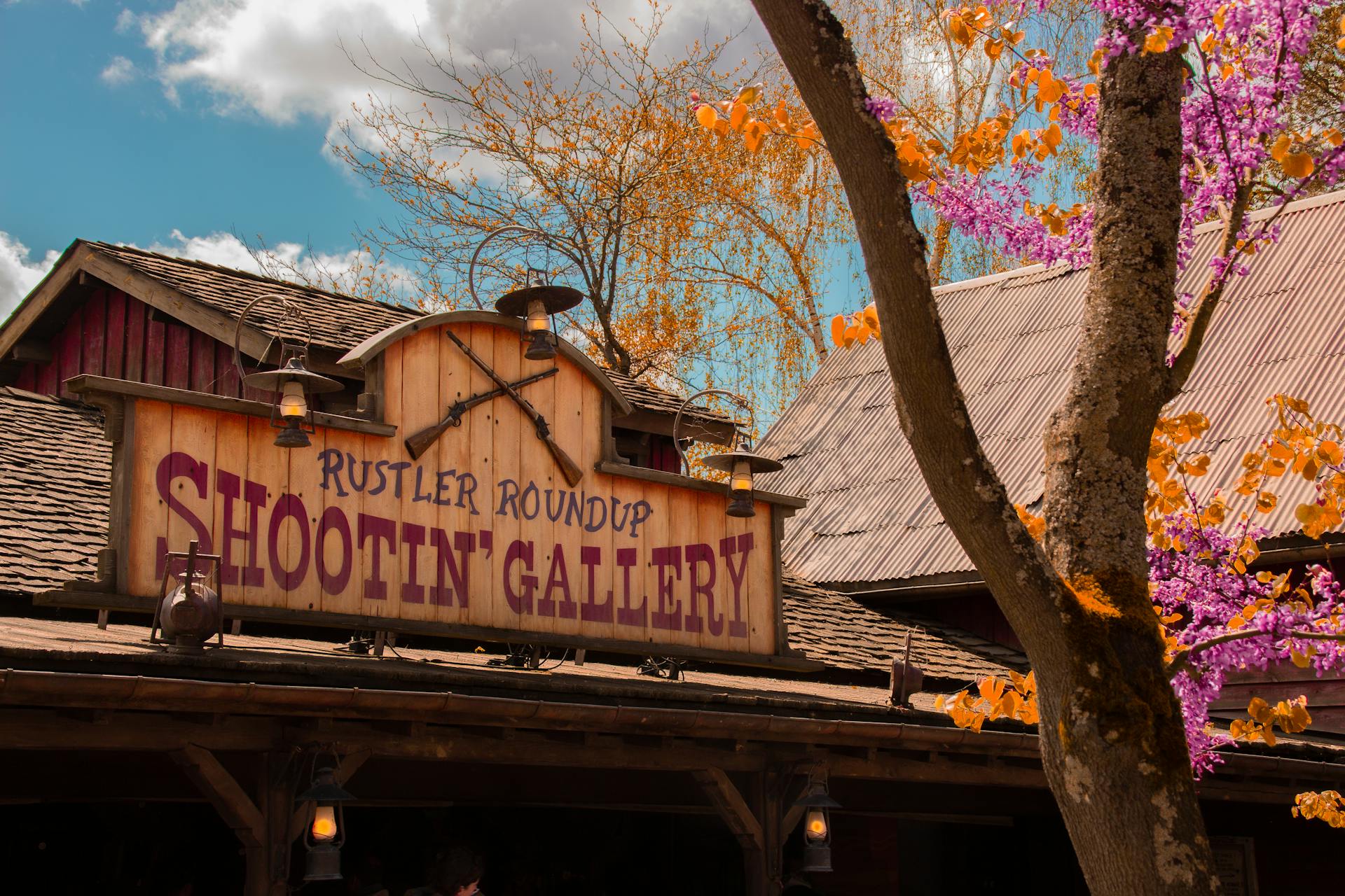 Wooden Sign of Rustler Roundup Shooting Gallery in Disneyland in France