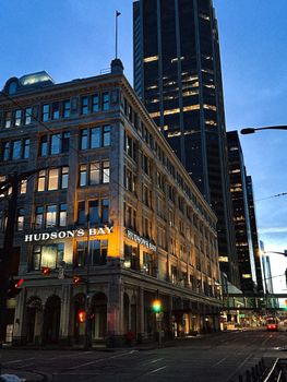 Urban view of Hudson's Bay and towering skyscrapers in downtown Calgary at twilight, Alberta, Canada.