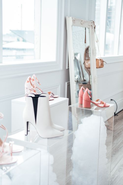 Free Modern shoe collection elegantly displayed in a chic boutique with natural lighting. Stock Photo