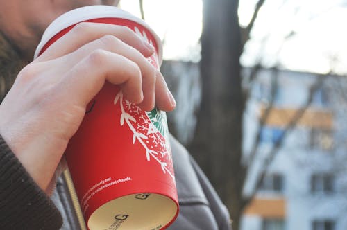 Person Holding Red Cup