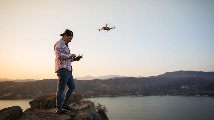 Man Flying A Drone