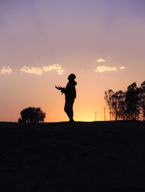 A Man's Silhouette During Sunset