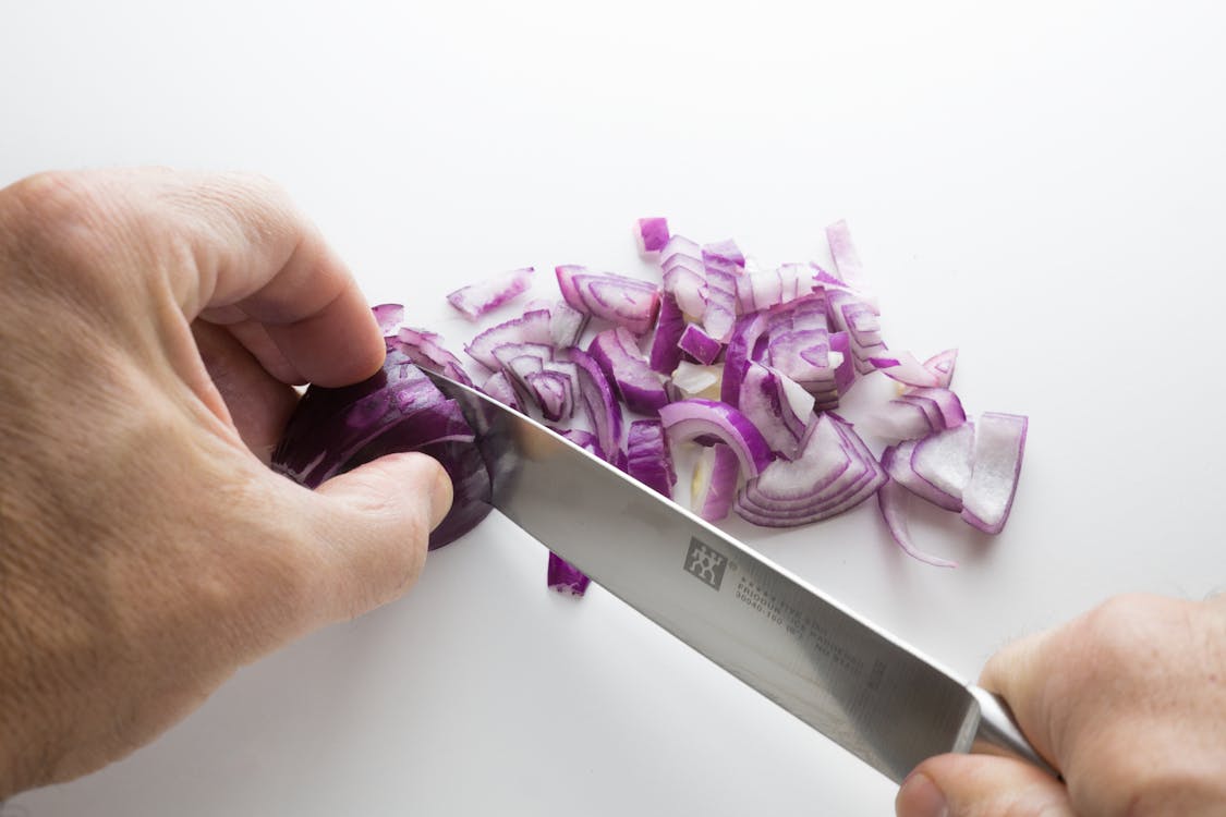 Free Person's Chopping Onion Stock Photo