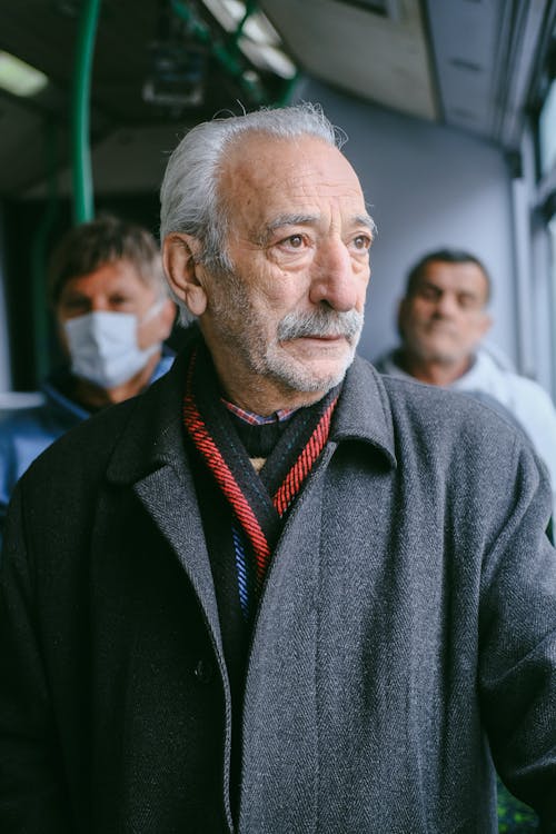 Thoughtful Old Man on the Bus