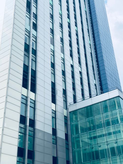Free A low angle view of a sleek modern office building in Cardiff, Wales. Stock Photo