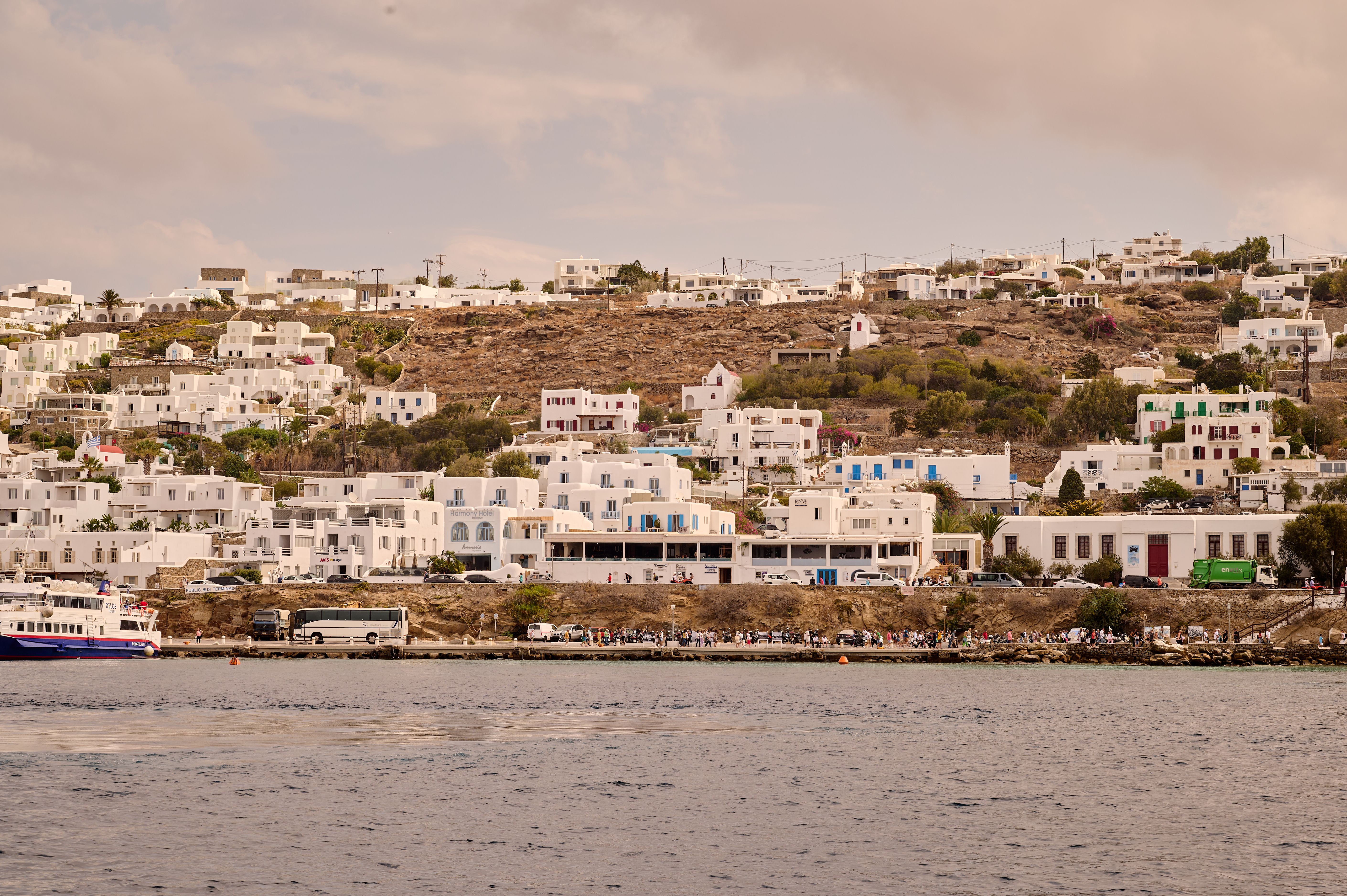 Free Scenic view of Mykonos Island with iconic white architecture nestled on a hill by the sea. Stock Photo