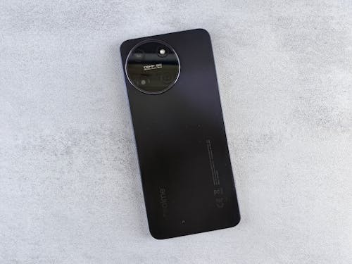 A black phone with a lens on it