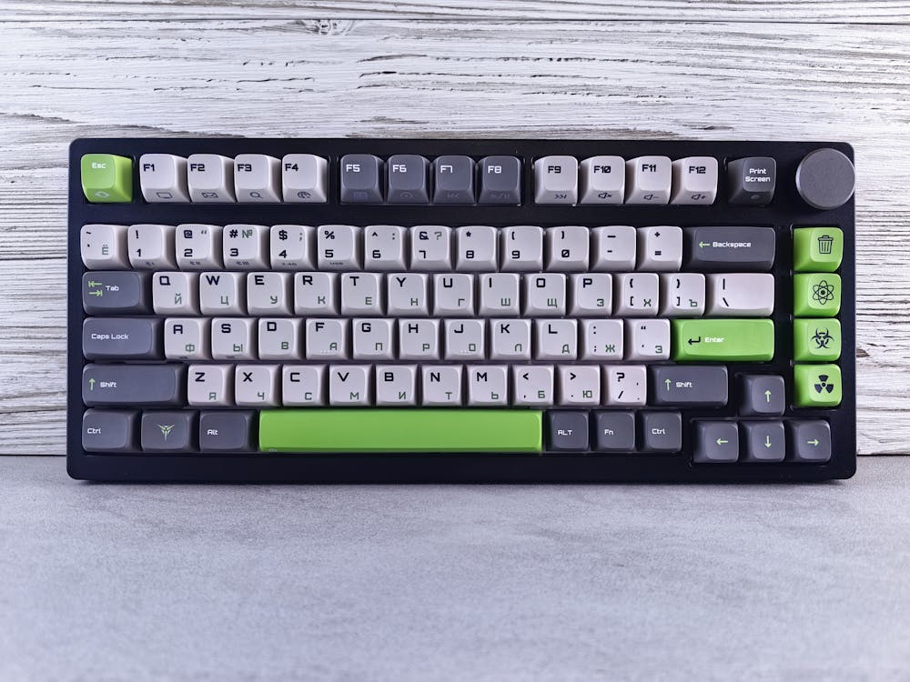 A green and white keyboard with a black and white key