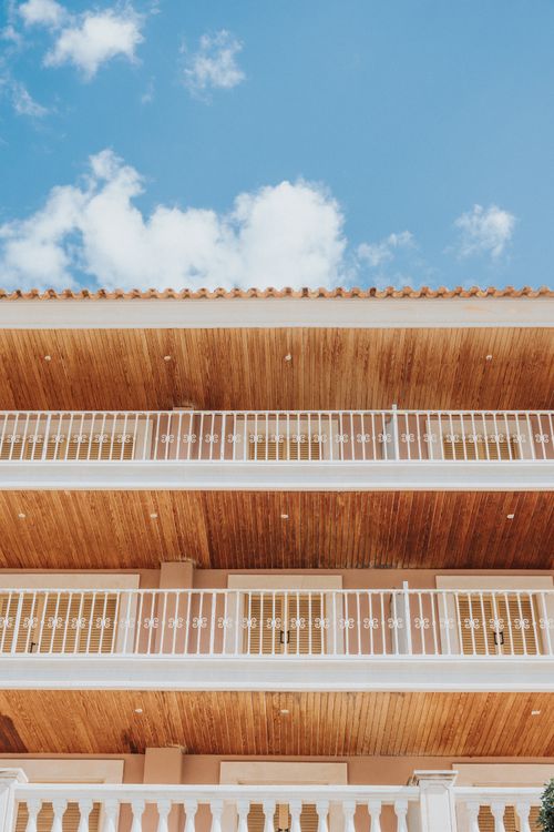 Free Charming view of Port d’Andratx building balconies against a clear blue sky. Stock Photo