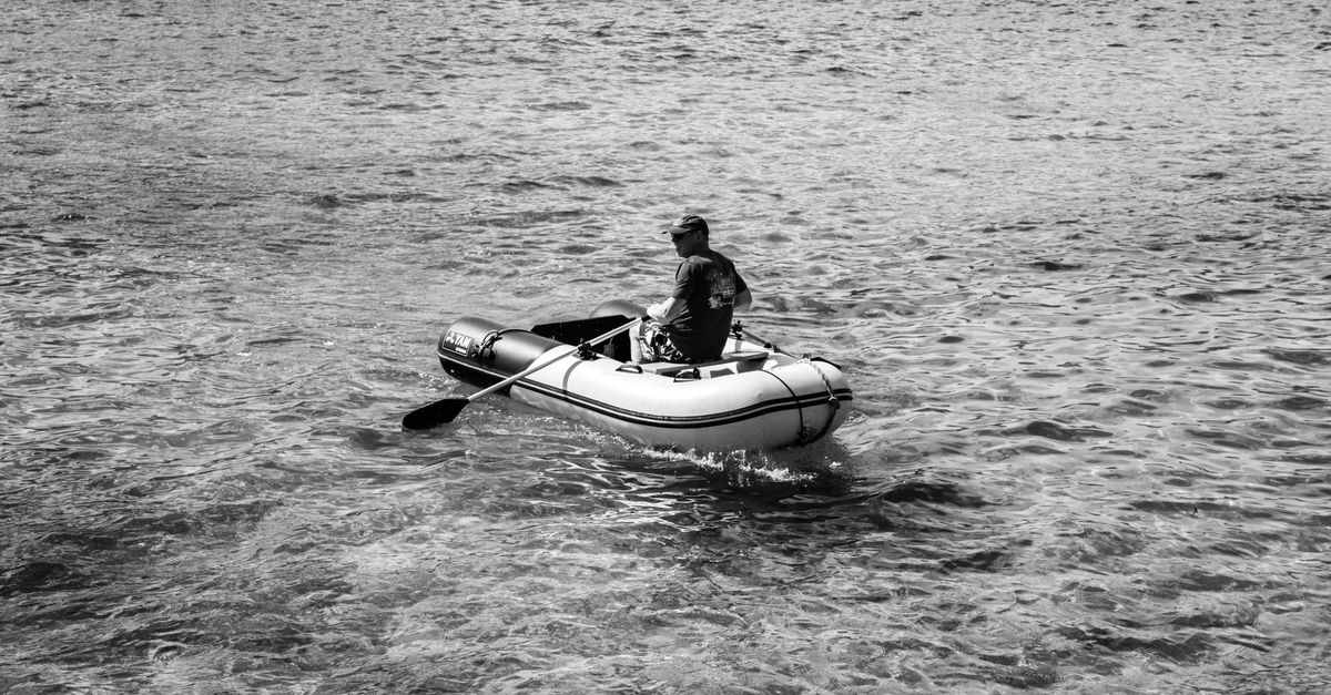 Guy On Inflatable Raft Man in Inflatable Boat · Free Stock Photo