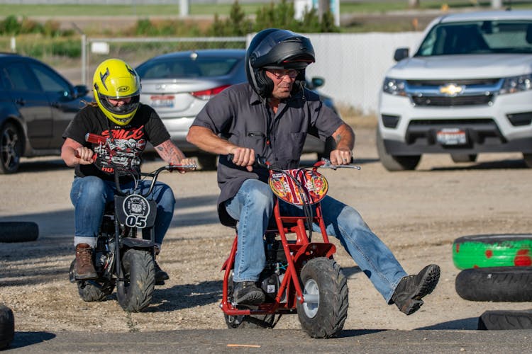 Men Riding On Moped Bikes