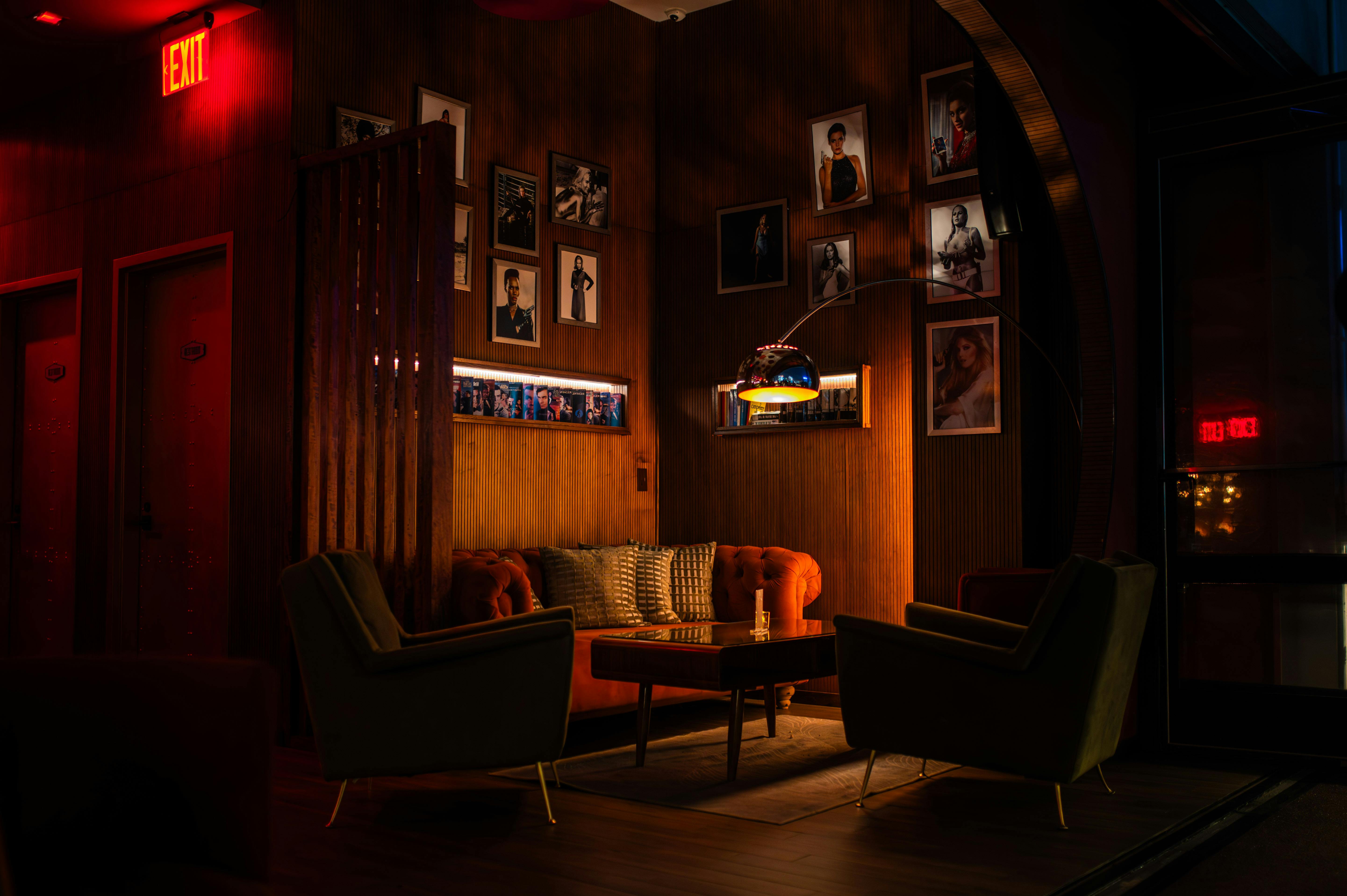 interior of an upscale swinger club with lounge area and dim lighting - Swinger party reviews