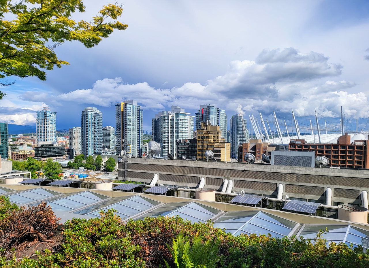 stunning view of vancouver s modern skyscrapers under a cloudy sky