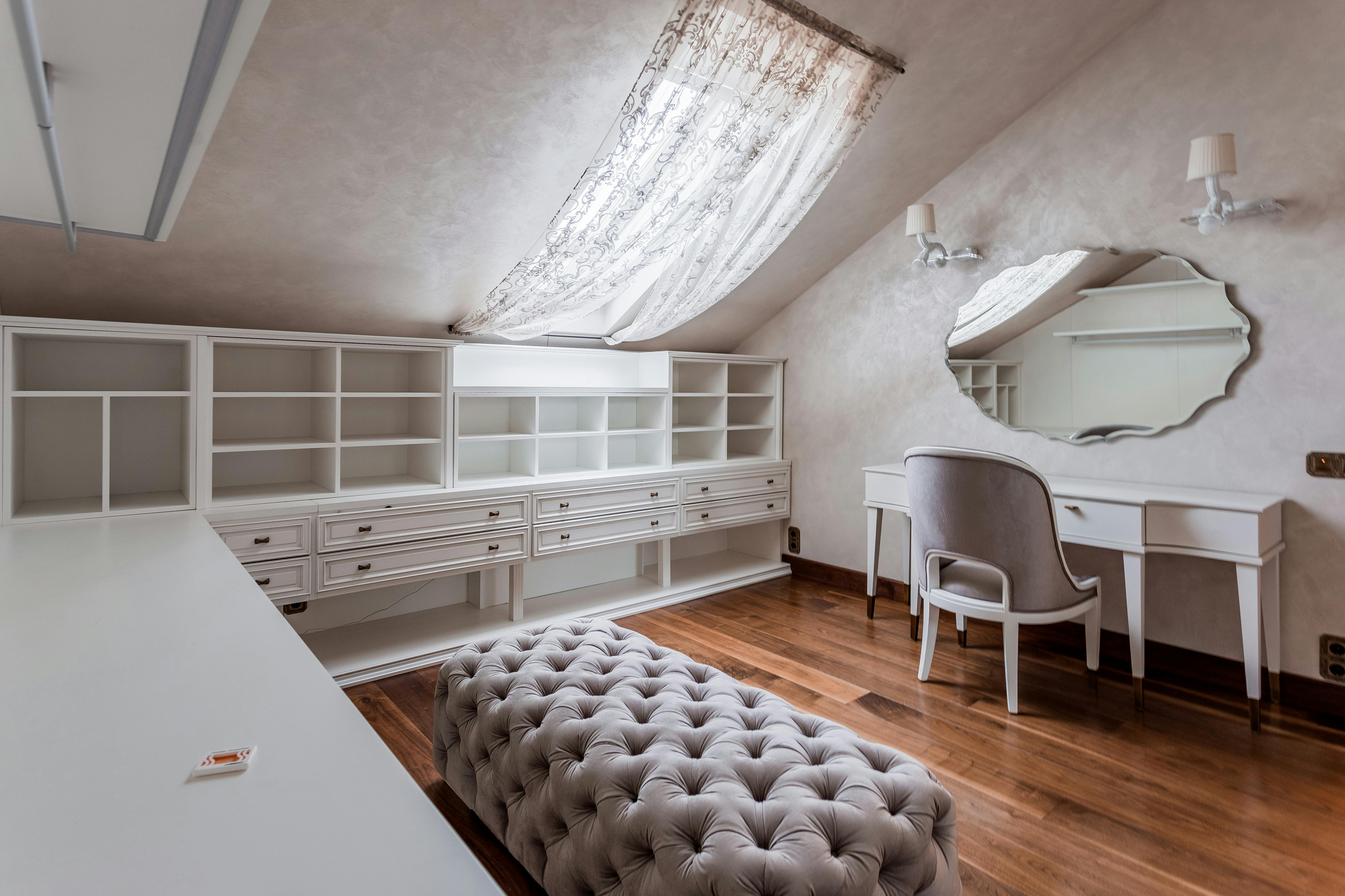 Spacious vanity room with elegant furniture and a soft, natural light ambiance.