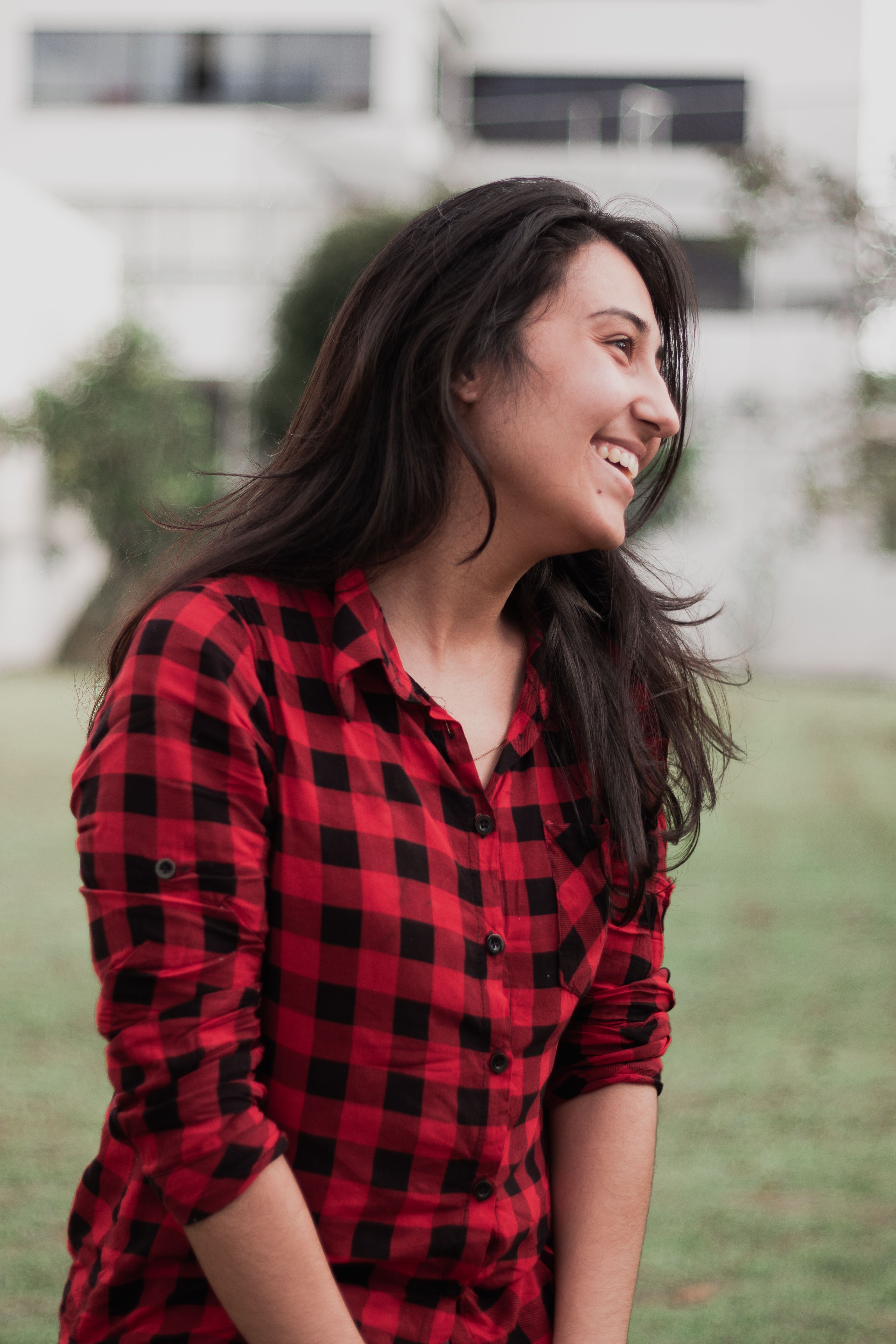 Woman Standing on Green Grass Field · Free Stock Photo