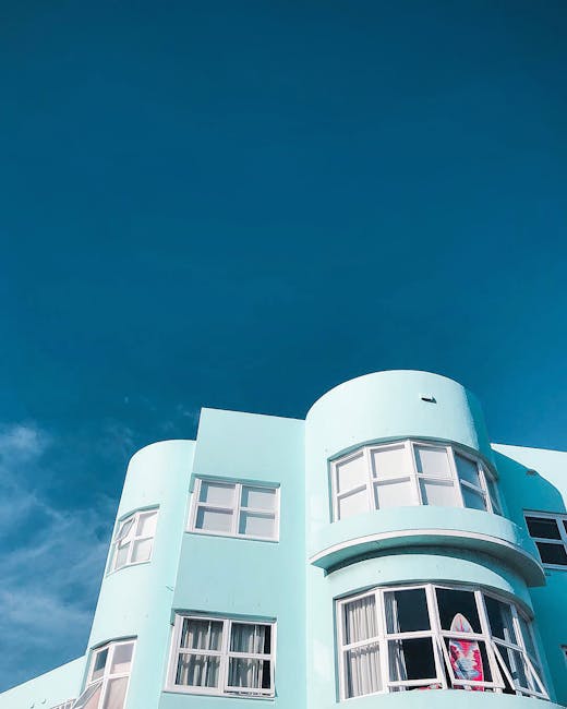 Modern art deco building facade in Sydney under a clear blue sky, capturing architectural elegance.