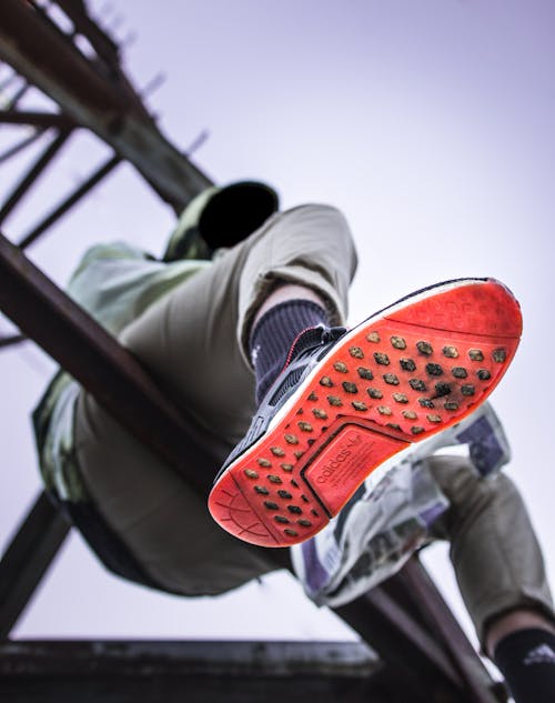 Man Sitting on Tower Base