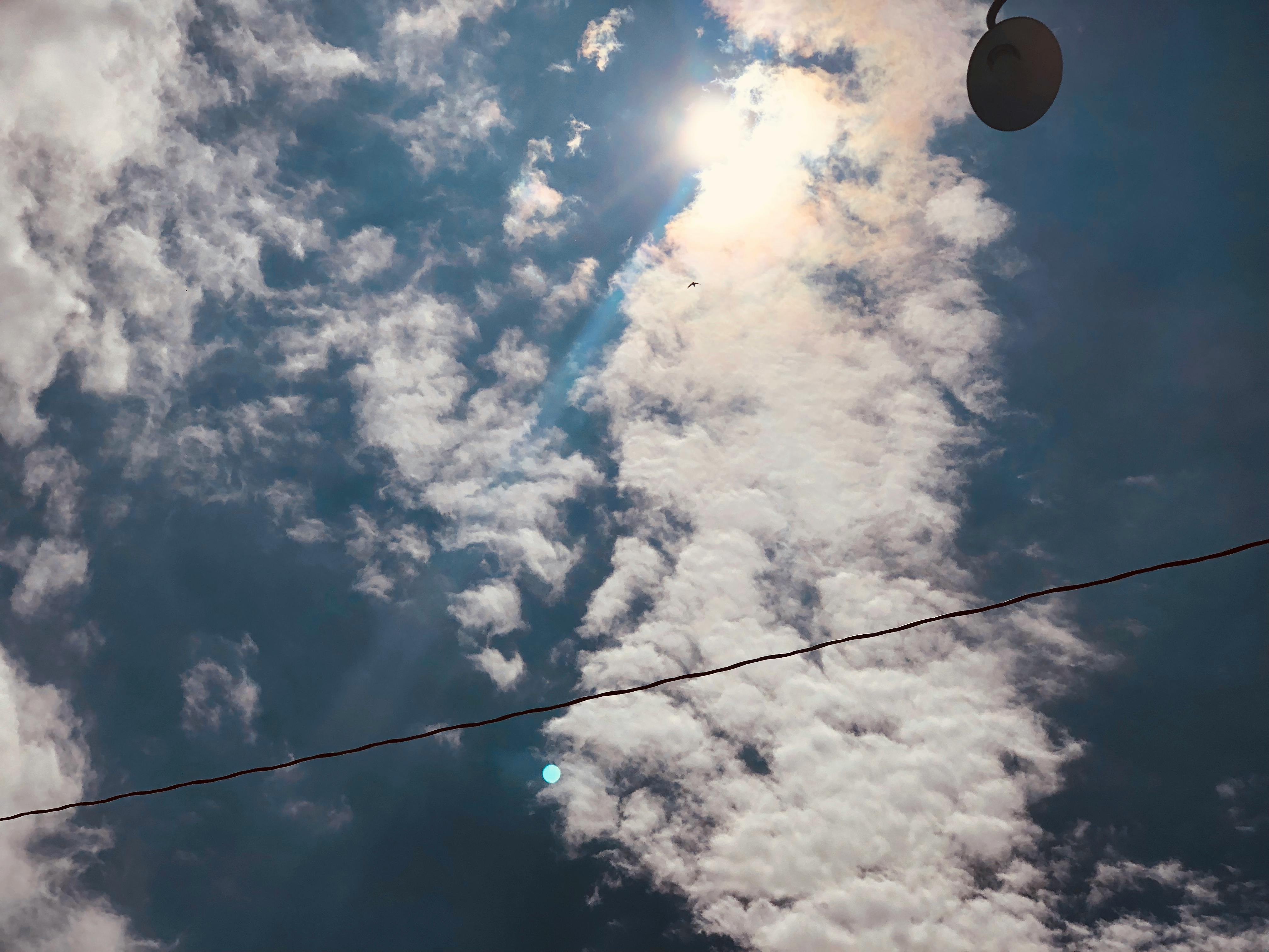 Quinoa bowl topped with roasted vegetables, greens, and a creamy dressing