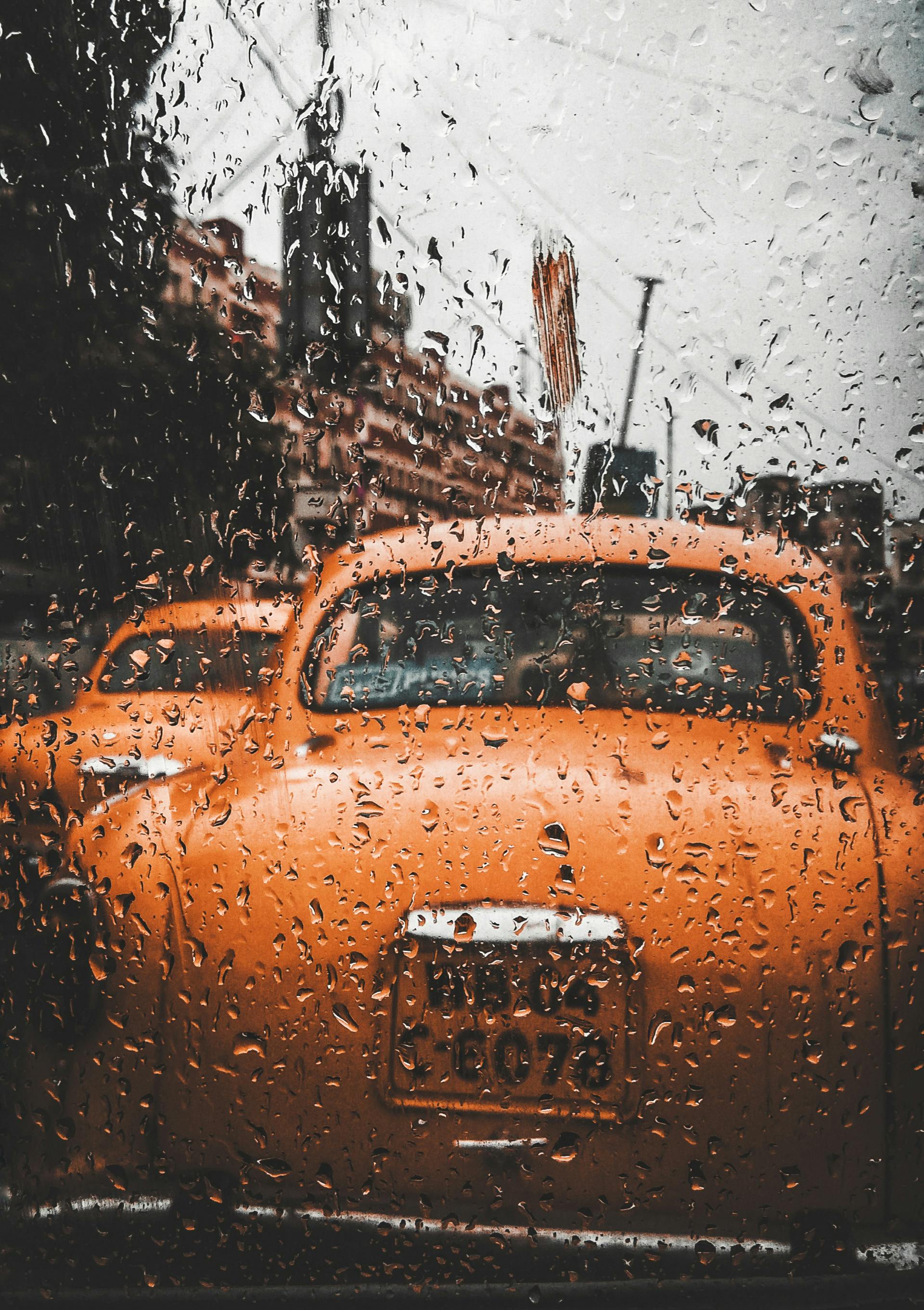 water dew on orange car
