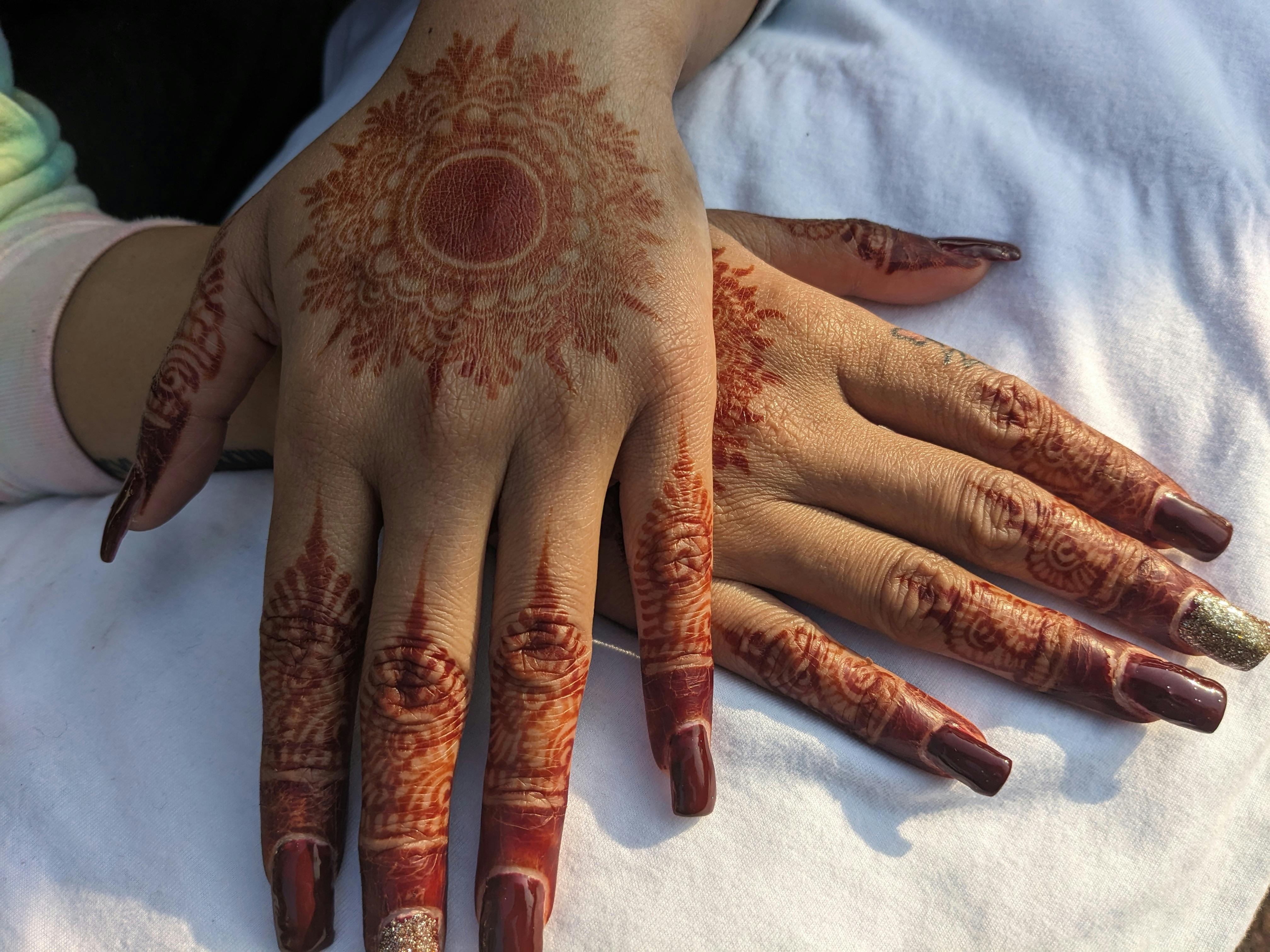 henna tattoos on woman hands