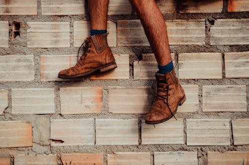 Person Wearing Brown Leather Boots