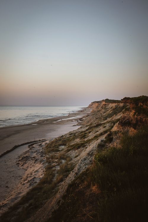 Free Breathtaking view of Løkken coastline with cliffs and sea at sunset, showcasing natural beauty. Stock Photo